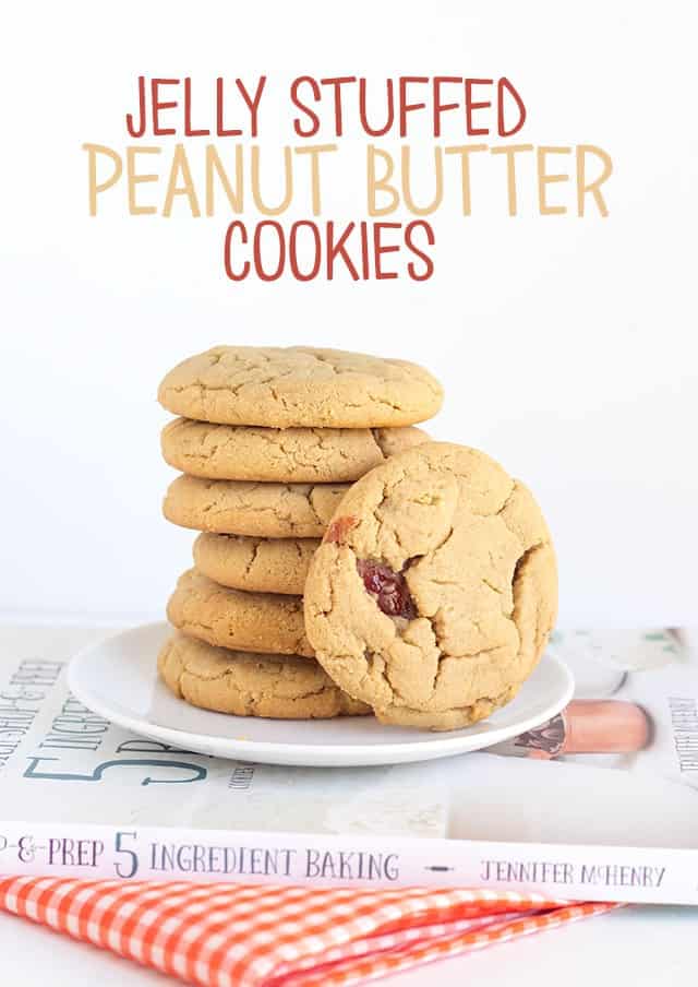 Jelly Stuffed Peanut Butter Cookies - step aside pb&j sandwiches. These cookies are soft peanut butter cookies stuffed with a strawberry jelly. Every bite has a hint of jelly!