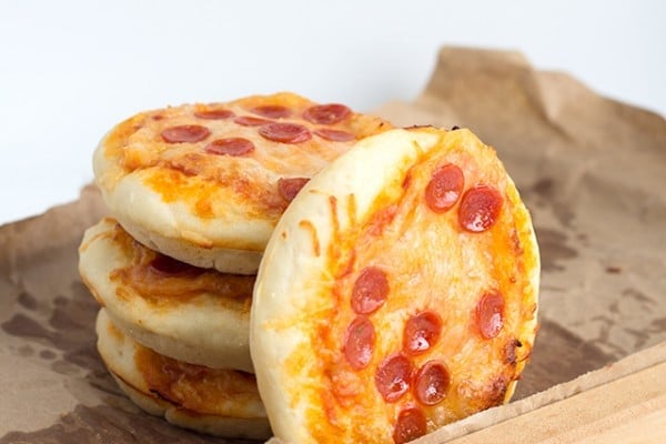 Mini Pizzas stacked onto a serving tray