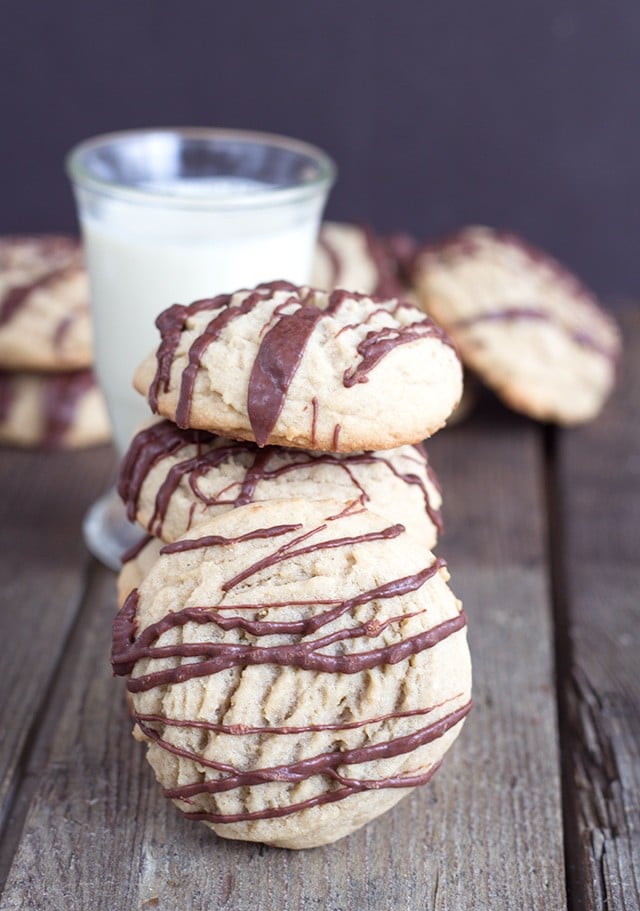 short stack of Coffee Cookies with a Chocolate Drizzle with one cookie predominately placed in the front of the stack