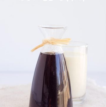 Coffee syrup next to glass milk.