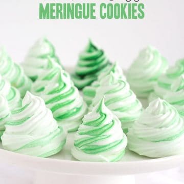 Mint kiss meringue cookies on a plate.