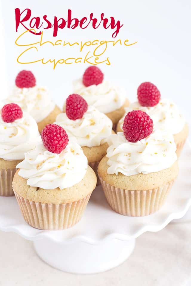 Raspberry Champagne Cupcakes - Kick off the new year with champagne cupcakes filled with a raspberry champagne filling and topped with a champagne frosting.