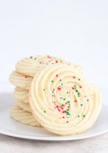 Spritz Cookies - festive swirled cookies full of almond flavor and piped with a star tip.