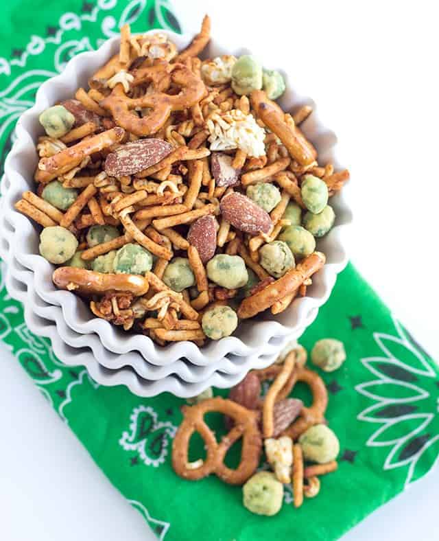 St. Patrick's Day snack mix with wasabi and soy sauce flavors in a bowl on a green napkin.
