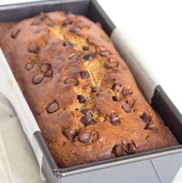 A pan with a chocolate chip banana bread loaf.