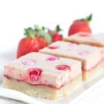 Strawberry Cheesecake Bars - shortbread topped with strawberry jam, cheesecake and strawberry flavored M&M's®!