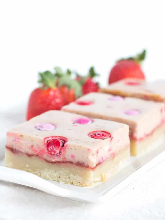 Strawberry Cheesecake Bars - shortbread topped with strawberry jam, cheesecake and strawberry flavored M&M's®!