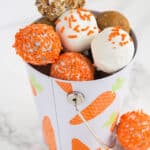 cream cheese carrot cake cake pops in a bucket decorated for Easter