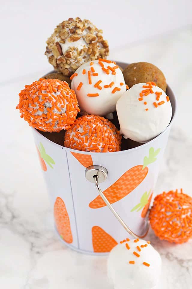 cream cheese carrot cake cake pops in a bucket decorated for Easter