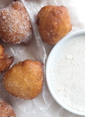 Banana fritters dusted with powdered sugar