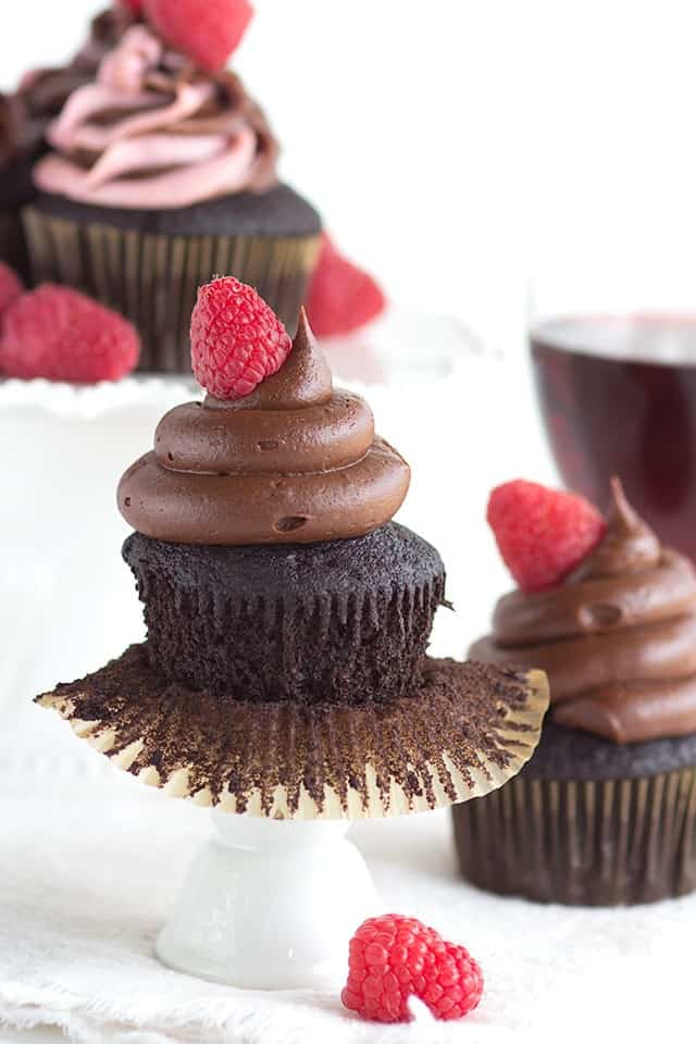 Red Wine-infused Chocolate Cupcakes with raspberries and chocolate frosting.