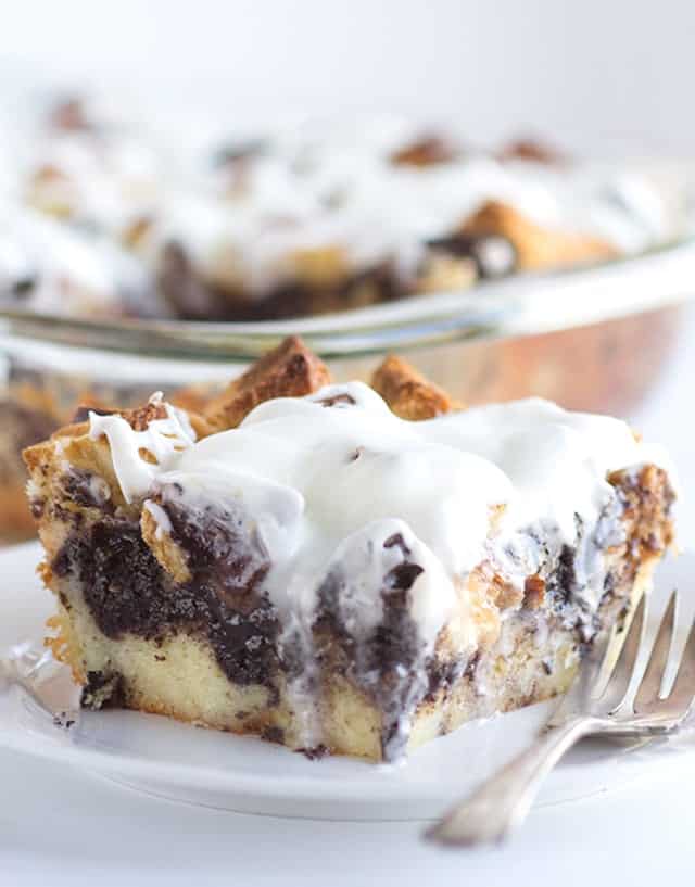 A slice of Cookies and Cream Bread Pudding on a plate with a fork.