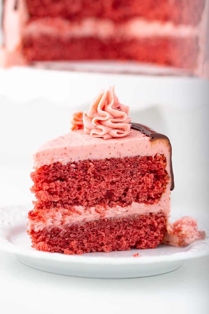 slice of strawberry cake on a small white dessert plate