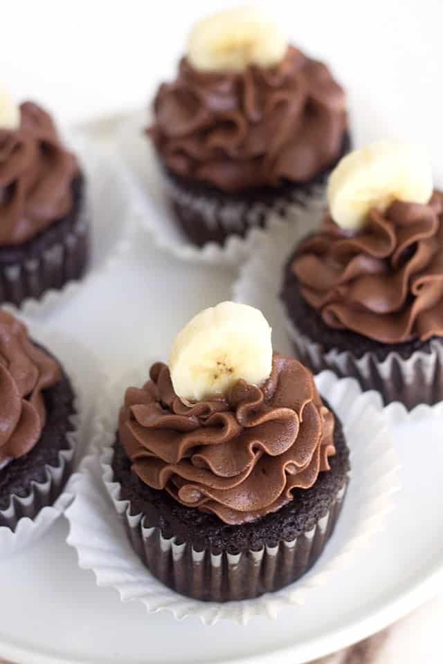 Chocolate Banana Cupcakes with a chocolate frosting and topped with a fresh banana slice!