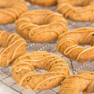 apple peanut butter dog donuts on a wire rack