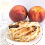Grilled Peach Pies - delicious grilled peaches packed inside a pie crust and grilled until golden brown!