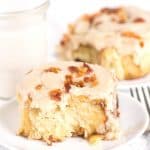 A slice of cinnamon roll on a plate.