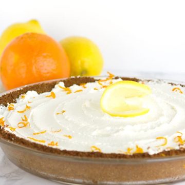 A Tangerine Cream Pie garnished with orange slices.