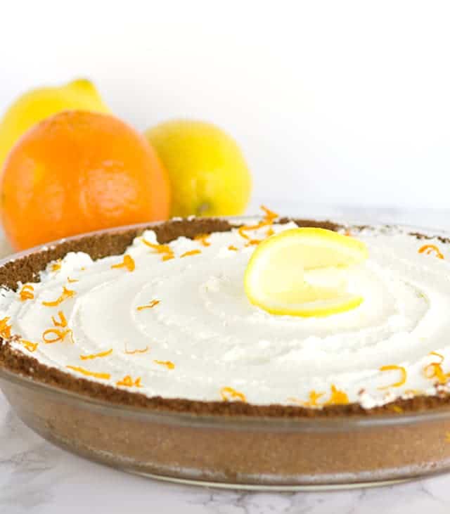 A Tangerine Cream Pie garnished with orange slices.