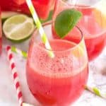 Watermelon Fizz served with lime slices and straws.