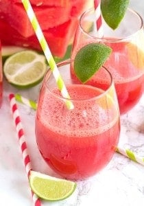 Watermelon Fizz served with lime slices and straws.