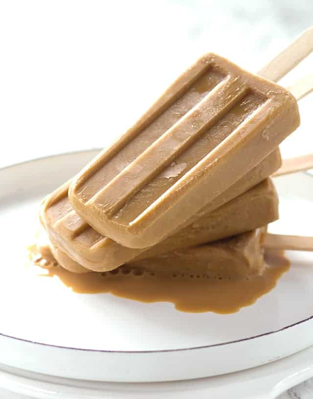 Boozy Caramel Coffee Popsicles - This is a simple 3 ingredient recipe that's for adults only! It's refreshing and will make any coffee lover's day!