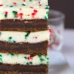 A stack of molasses cheesecake bars on a plate.