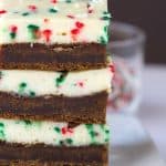 Molasses Cheesecake Bars - a dense and soft molasses cookie layer with a festive sprinkle packed cheesecake top.