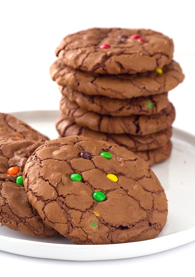 stacked Brownie Cookies with M&M's on a white plate