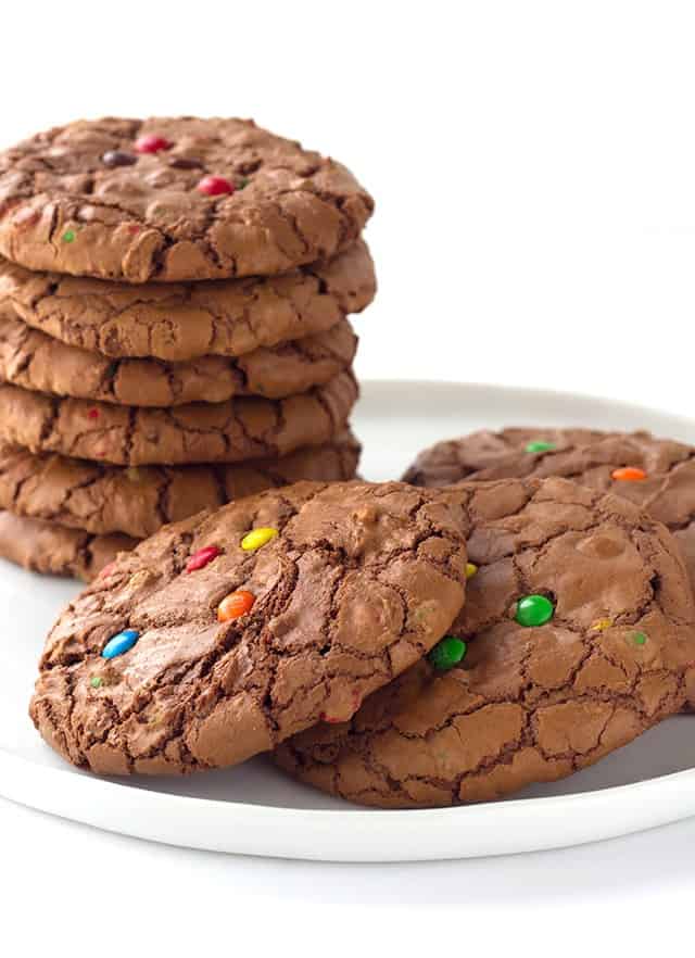 Brownie Cookies are rich chocolate cookies loaded with semi-sweet chocolate chips with a shiny crispy brownie top, studded with M&M chocolate candies.
