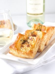 Jalapeno Popper Bites - a delicious appetizer with golden puff pastry loaded with jalapenos, pepper jack and cheddar cheese, and loads of bacon.
