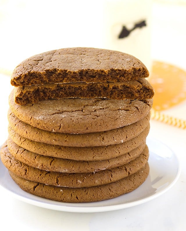 stack of Molasses Cookies with one broken in half so you can see the chewy center