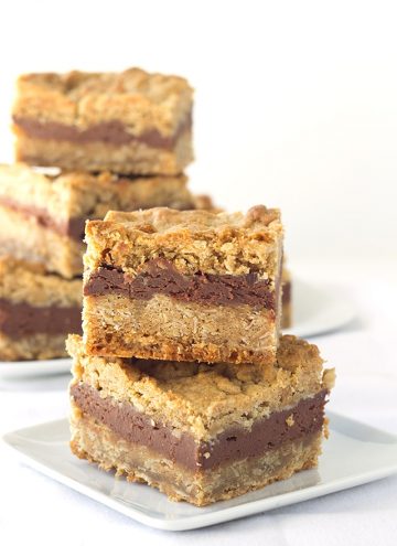 Chocolate Peanut Butter Oatmeal Bars - oatmeal bars made from peanut butter oatmeal cookie dough with a chocolate cheesecake filling in the middle!
