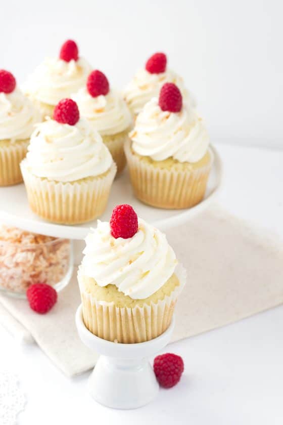 Coconut Cupcakes with Raspberry Filling - Cookie Dough and Oven Mitt