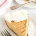 Cookie Butter Pie -a speculoos cookie crust with a creamy cookie butter cheesecake mousse filling. Drizzle with a little additional cookie butter and pipe some whipped cream swirls to finish the pie.
