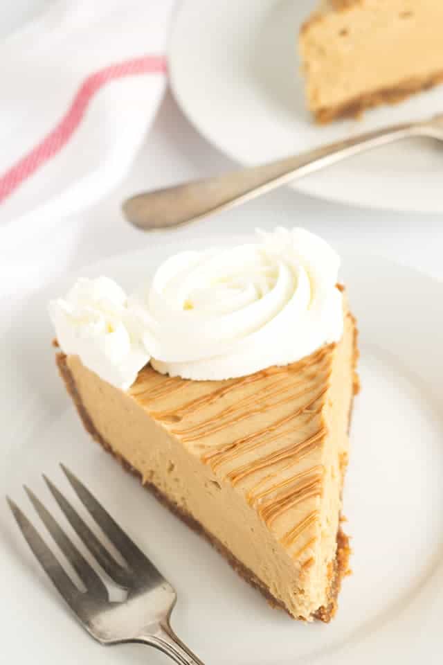 Cookie Butter Pie -a speculoos cookie crust with a creamy cookie butter cheesecake mousse filling. Drizzle with a little additional cookie butter and pipe some whipped cream swirls to finish the pie.