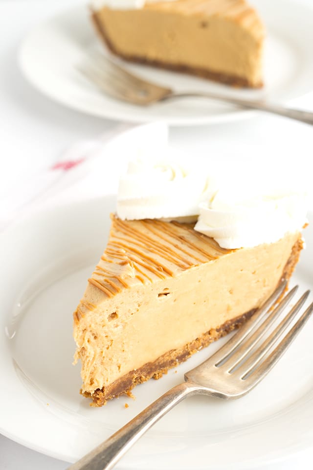 Cookie Butter Pie -a speculoos cookie crust with a creamy cookie butter cheesecake mousse filling. Drizzle with a little additional cookie butter and pipe some whipped cream swirls to finish the pie. 