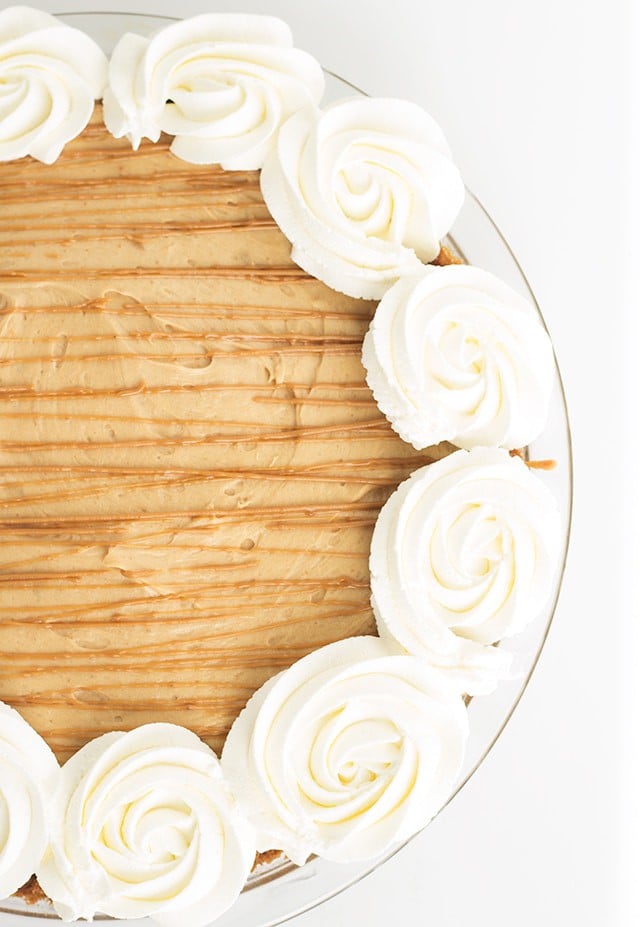 Cookie Butter Pie -a speculoos cookie crust with a creamy cookie butter cheesecake mousse filling. Drizzle with a little additional cookie butter and pipe some whipped cream swirls to finish the pie. 