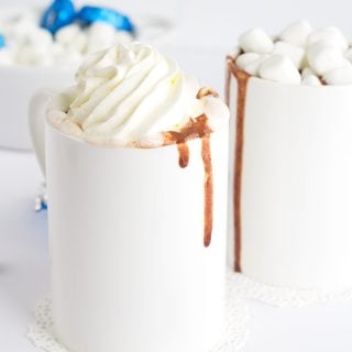 Thick and Creamy Slow Cooker Hot Chocolate. It's easy to throw together now and drink hot with marshmallows later! Easily customize it to be milk chocolate or semi-sweet chocolate!
