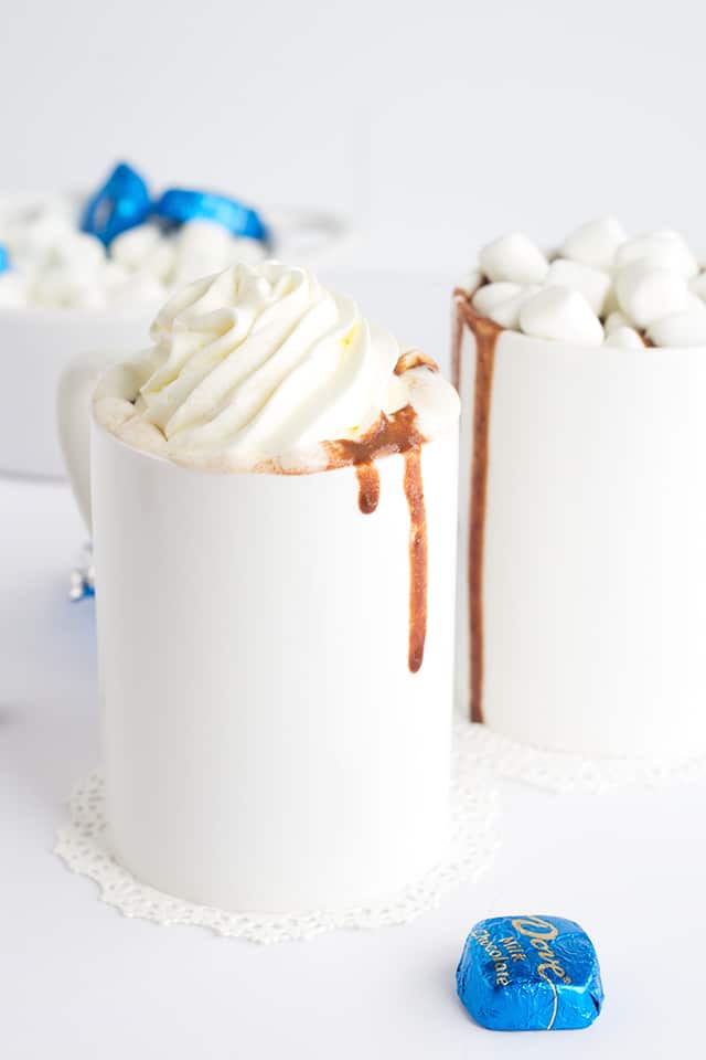 Thick and Creamy Slow Cooker Hot Chocolate. It's easy to throw together now and drink hot with marshmallows later! Easily customize it to be milk chocolate or semi-sweet chocolate!