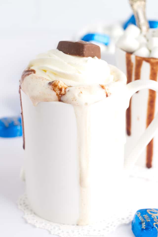 Thick and Creamy Slow Cooker Hot Chocolate. It's easy to throw together now and drink hot with marshmallows later! Easily customize it to be milk chocolate or semi-sweet chocolate!