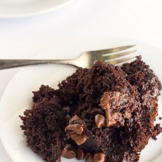 This slow cooker chocolate lava cake is simple to make and incredibly decadent. No mixer needed, just your hand and a whisk. Whether you want a hot dessert to warm you up in the winter or a dessert that doesn't require your oven being on in the summer, this chocolate lava cake has got you covered.