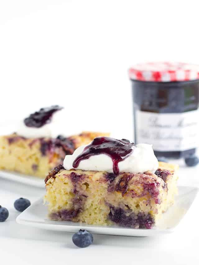 Bacon Blueberry Baked Pancakes - Need to feed a crowd or maybe just want to make a big brunch?This baked pancake done in a casserole dish is the way to go. It's packed with candied bacon, blueberry preserves, and brie cheese. Top with whipped cream and some more preserves and eat up!