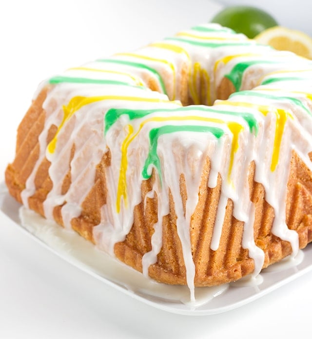 Tangy Lemon Lime Cake with Lemon Lime Glaze - It's a dense made from scratch pound cake with a box of lemon pudding and lime juice added in. The vibrant green and yellow stripes pop every bit as much as the flavor!