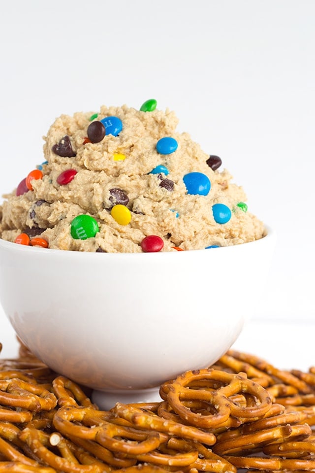 Monster Cookie Dough Dip - dip inspired by the monster cookie and perfect with pretzels. It's loaded with peanut butter, oatmeal, candies, and chocolate chips and whipped until light and airy.