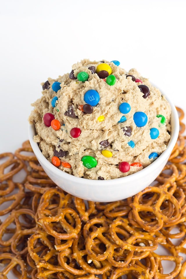 Monster Cookie Dough Dip - dip inspired by the monster cookie and perfect with pretzels. It's loaded with peanut butter, oatmeal, candies, and chocolate chips and whipped until light and airy.