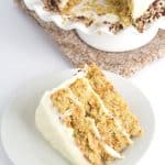 Pineapple Carrot Cake with Cream Cheese Frosting - the perfect Easter cake! It's full of crushed pineapple, shredded carrots, and cinnamon. It's slathered with a cream cheese frosting infused with pineapple juice and garnished with toasted pecans.