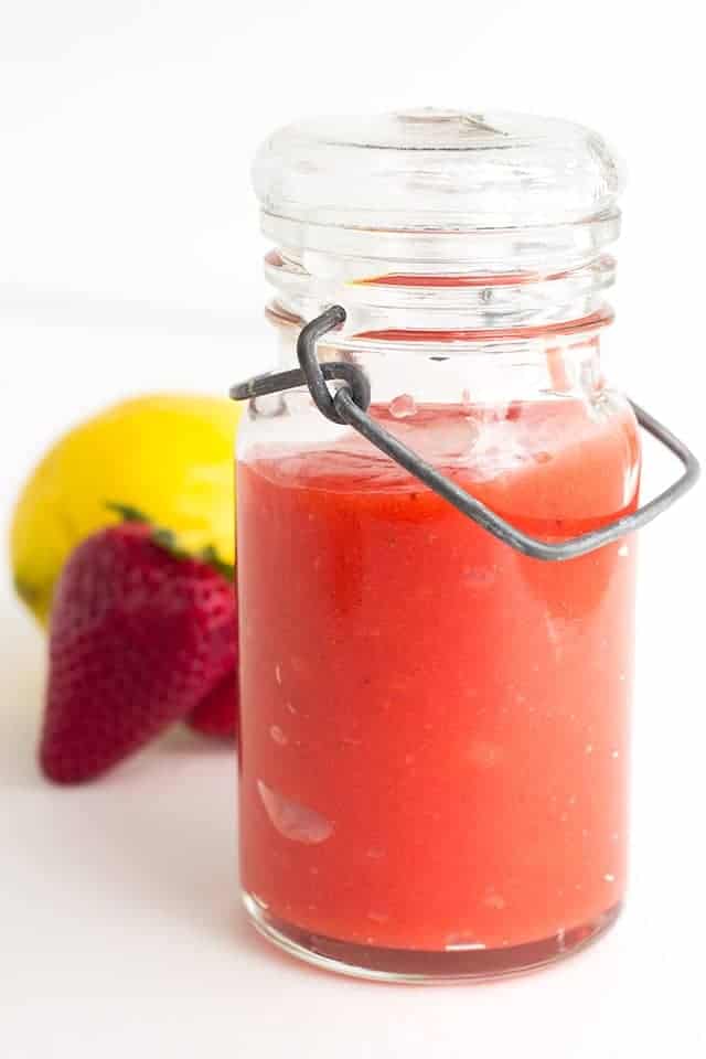 Strawberry Lemon Curd - fresh pureed strawberries and lemon juice make the perfect filling. It's sweet and is a delicious spring flavor to put in your cookies, cakes, and cupcakes!