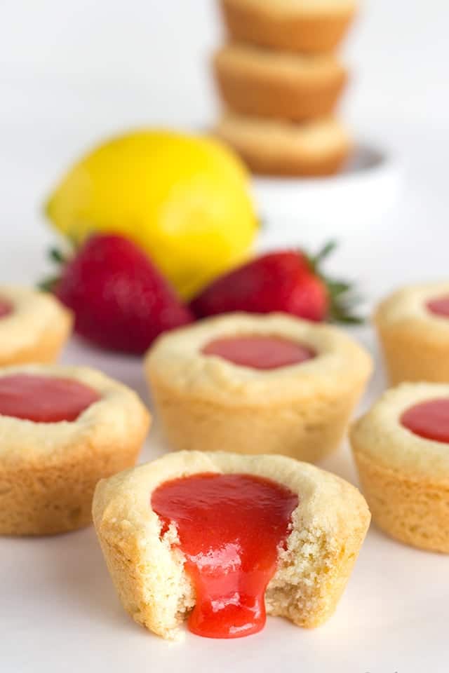 Strawberry Lemon Sugar Cookie Cups - tender sugar cookies baked in a cupcake tin. They're filled with a sweet and tangy strawberry lemon curd and make the perfect summertime cookie!