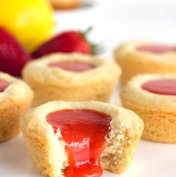 Strawberry Lemon Sugar Cookie Cups - tender sugar cookies baked in a cupcake tin. They're filled with a sweet and tangy strawberry lemon curd and make the perfect summertime cookie!